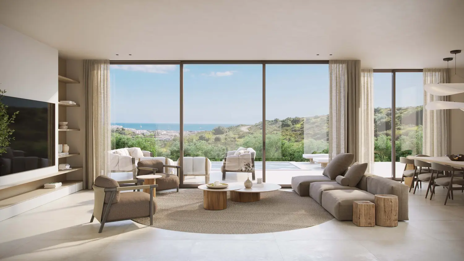 Open plan living space with sea views through full height glazing